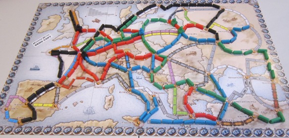 A map of Europe with colorful train tracks connecting major cities.